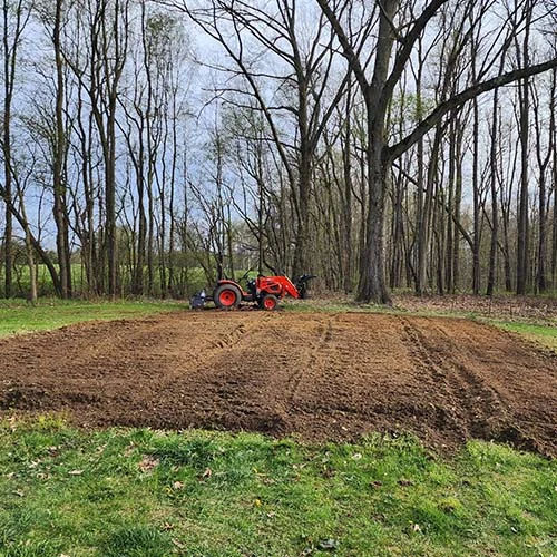 Tilled-Garden-Plot-with-Tractor.webp